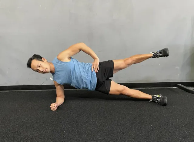 side plank with leg lift, fat burning exercise on the stomach
