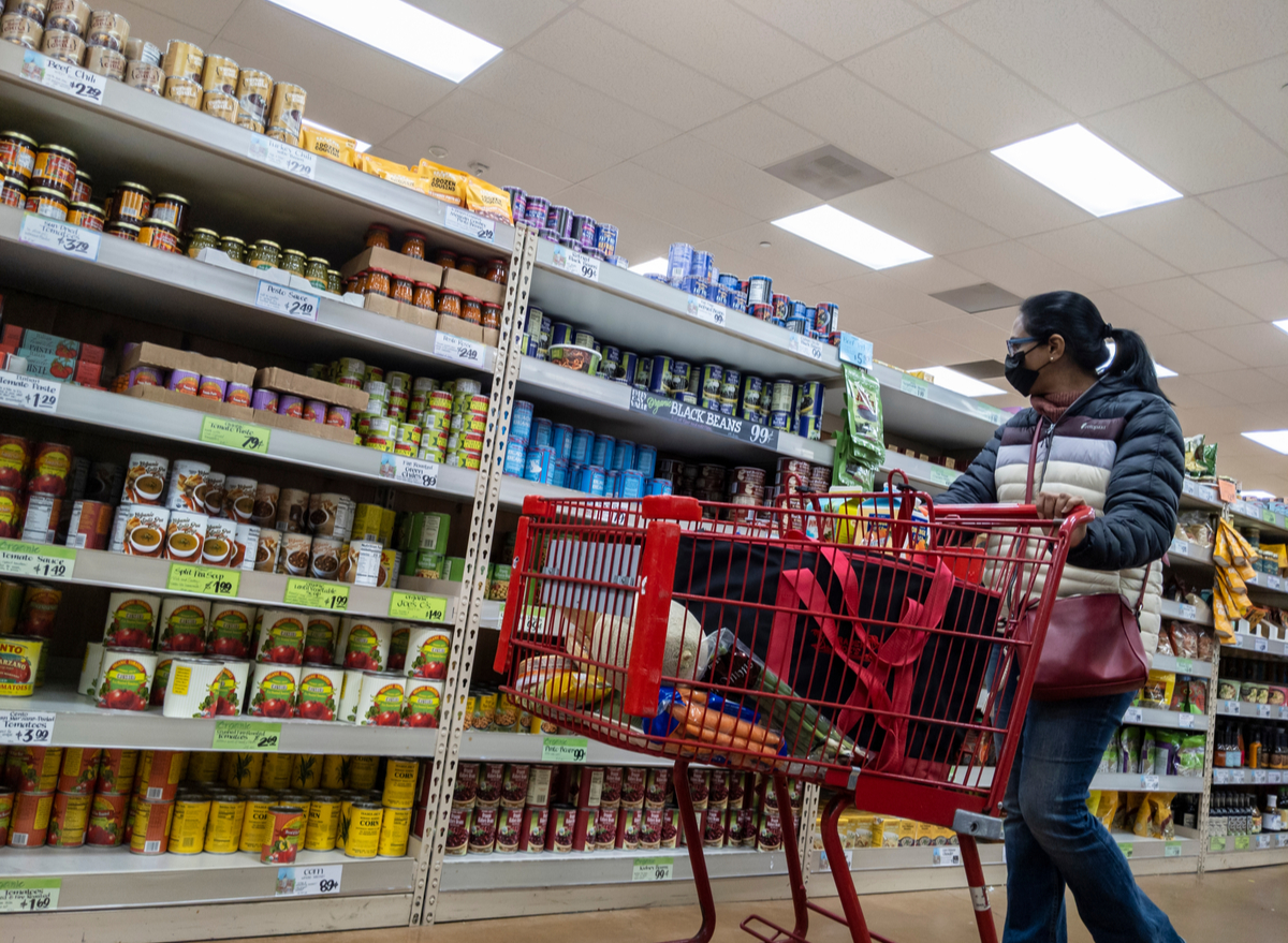 woman grocery shopping in trader joe's