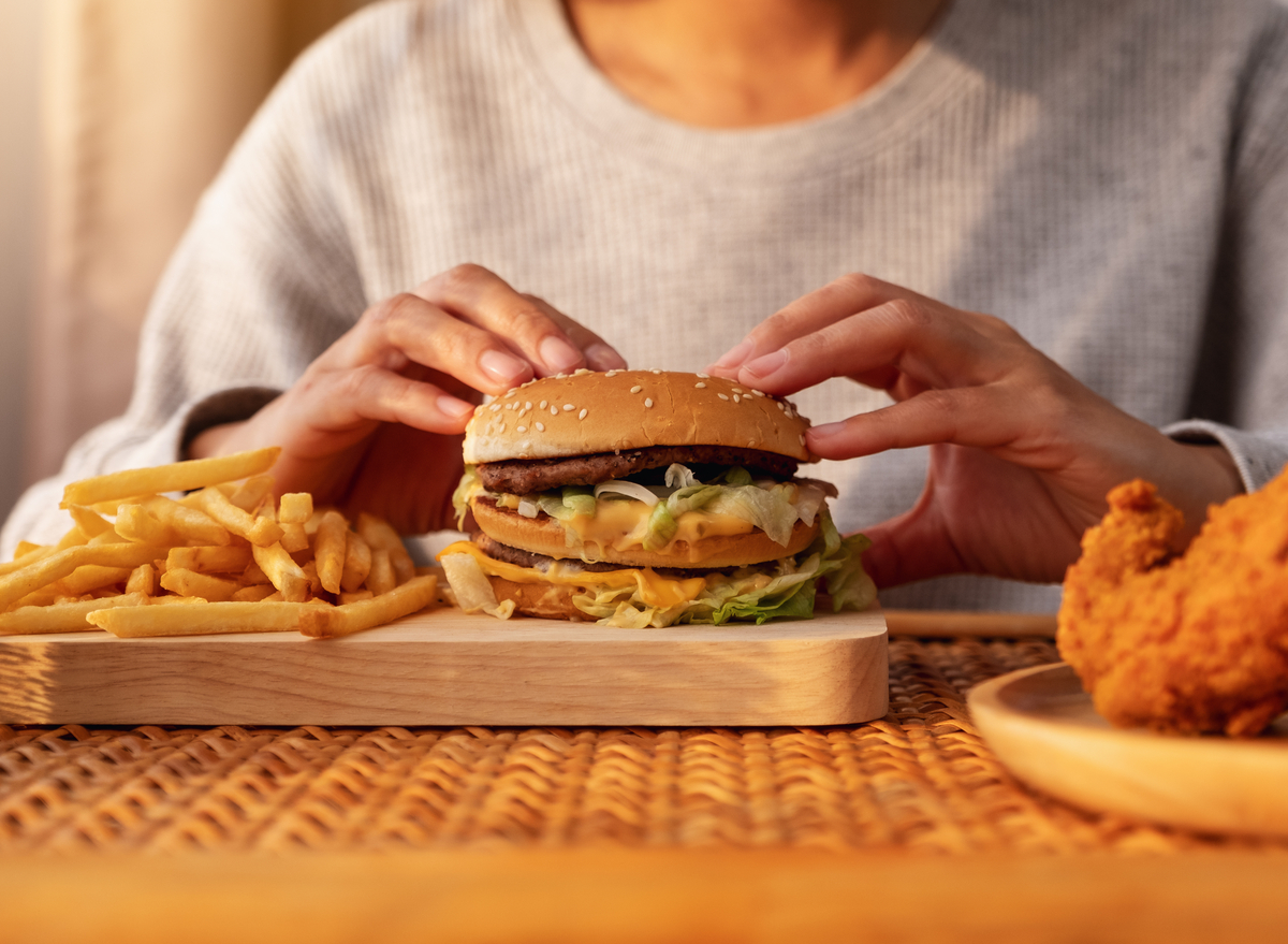 woman with hamburger and fries