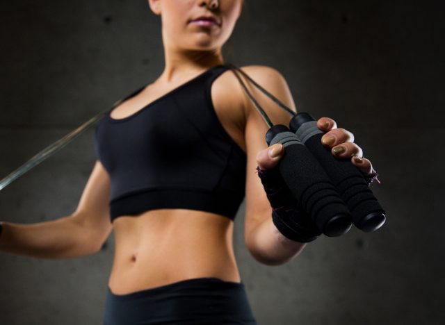 woman holding weighted jump rope