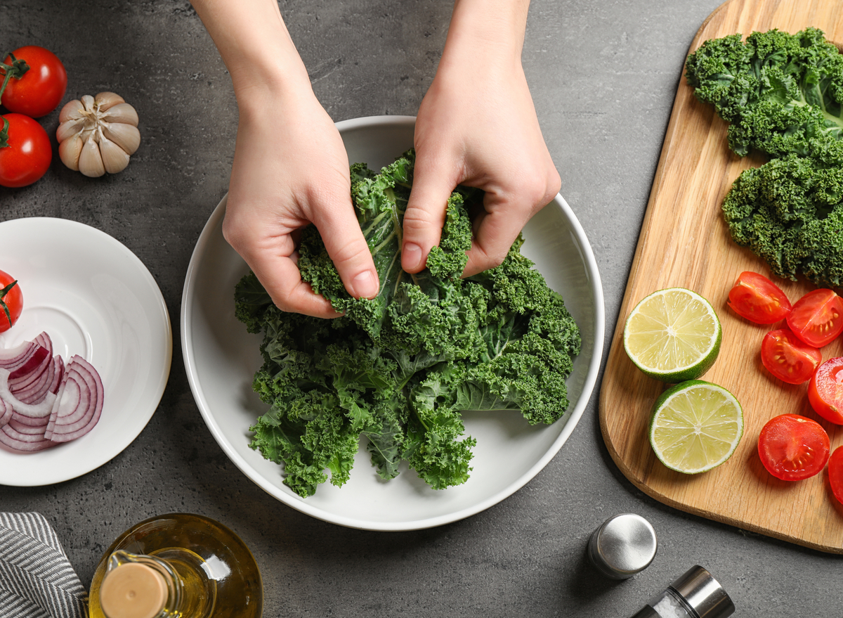 woman making kale salad