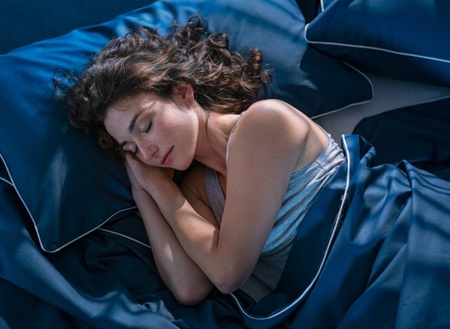 A woman who sleeps peacefully at night in bed