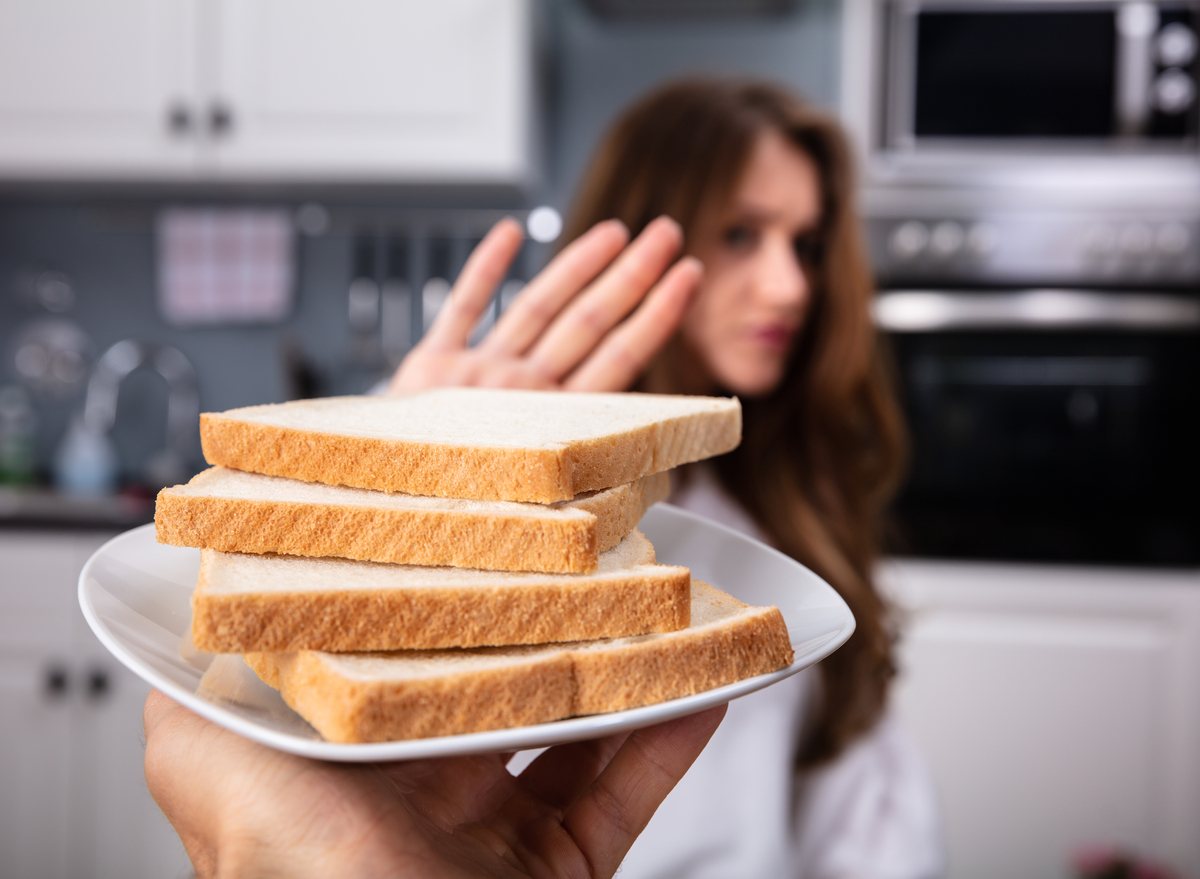 woman refusing white bread