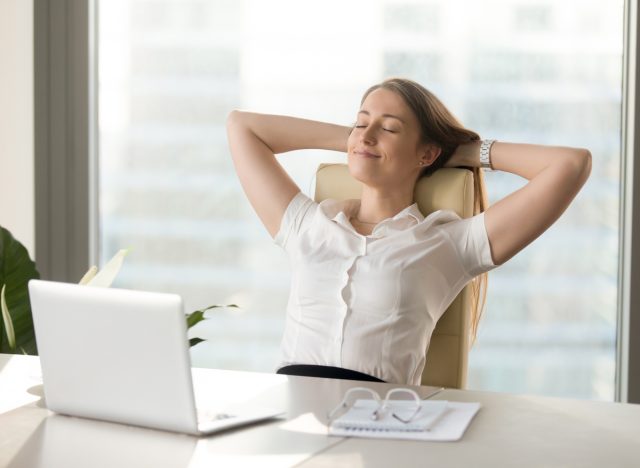 woman relaxing at desk