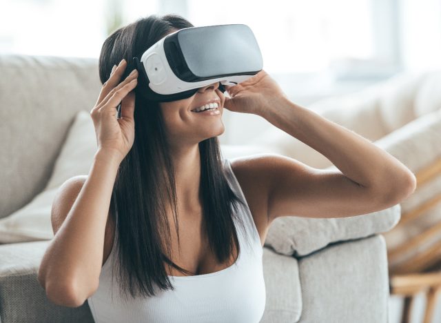 woman wearing VR headset for virtual workout stress reducer