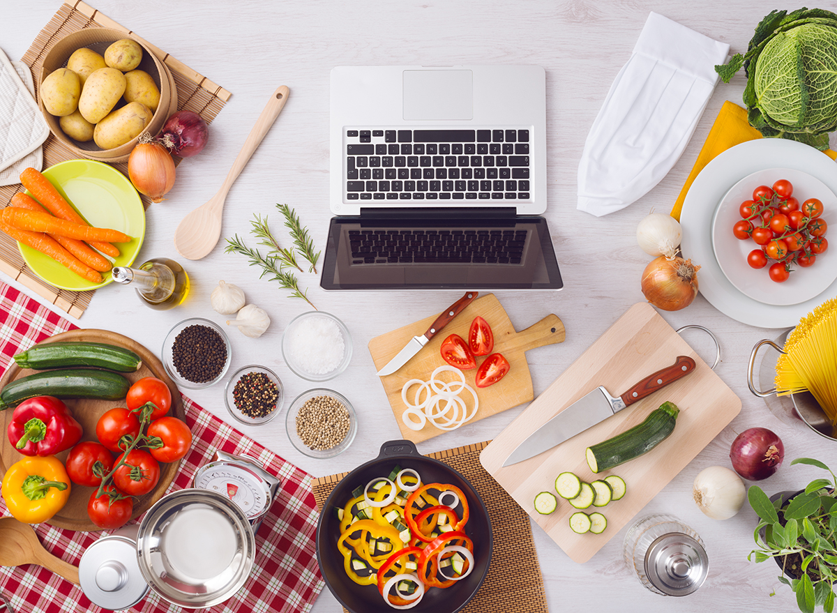 Laptop surrounded by food