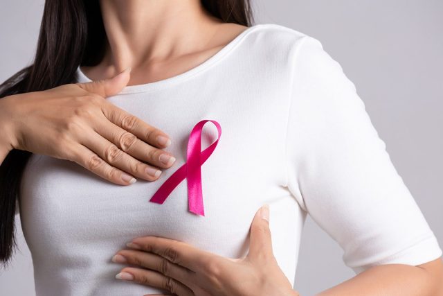 Woman with breast cancer ribbon
