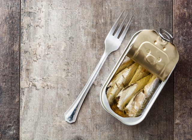 canned sardines and fork