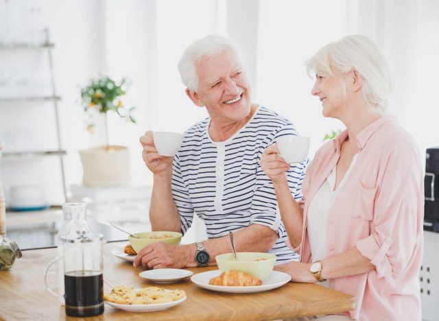 elderly couple eating breakfast