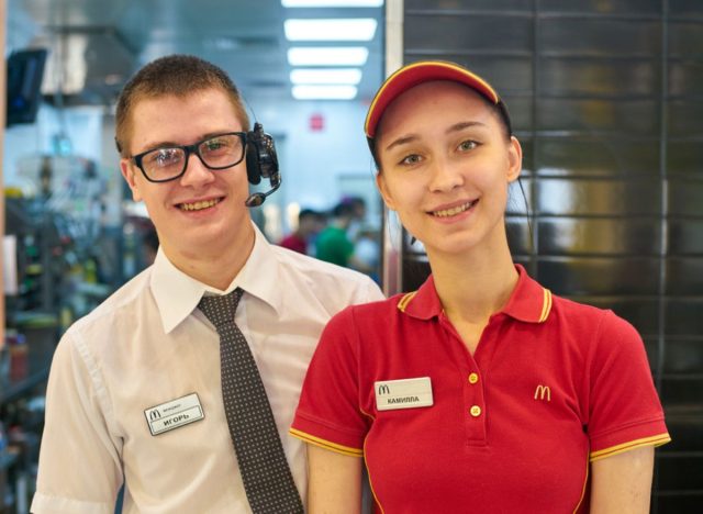 fast food restaurant manager and employee