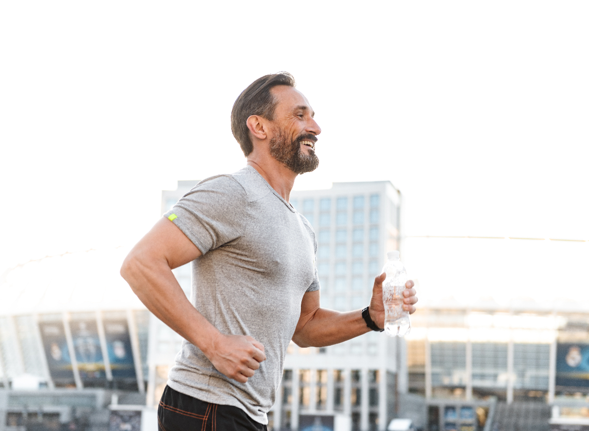 fit middle-aged man running, demonstrating how to jumpstart your metabolism after 40