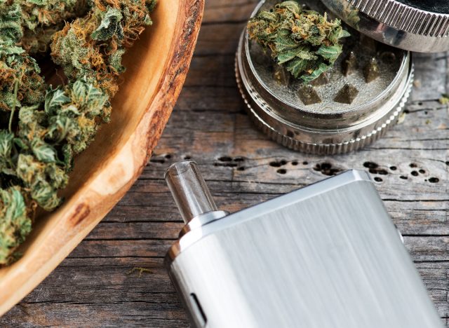 vaporizer with medical marijuana buds and grinder