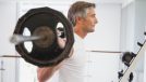 mature man barbell exercise demonstrating habits that are aging you faster