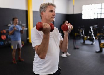 mature man demonstrating exercise to shrink your belly
