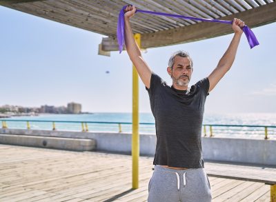 mature man resistance band visceral fat reducer