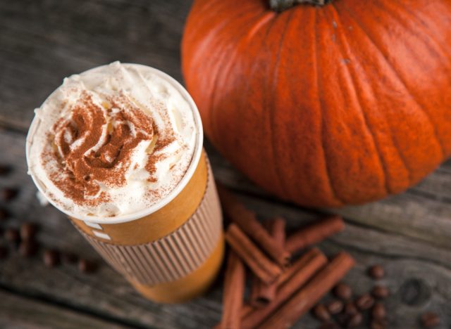 pumpkin spice latte, pumpkin, cinnamon sticks, and coffee beans