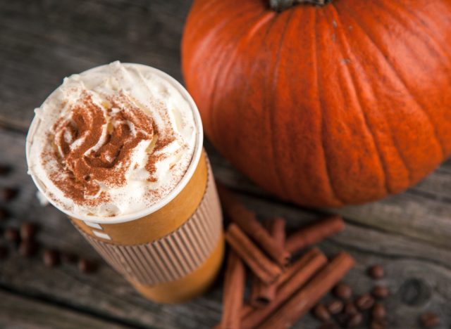 pumpkin spice latte, pumpkin, cinnamon sticks, and coffee beans