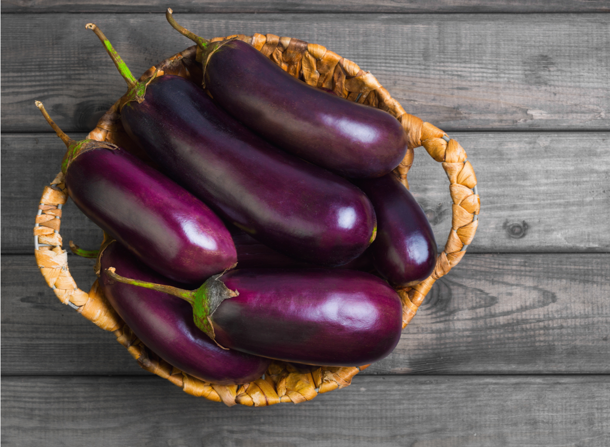 raw eggplant in basket. 