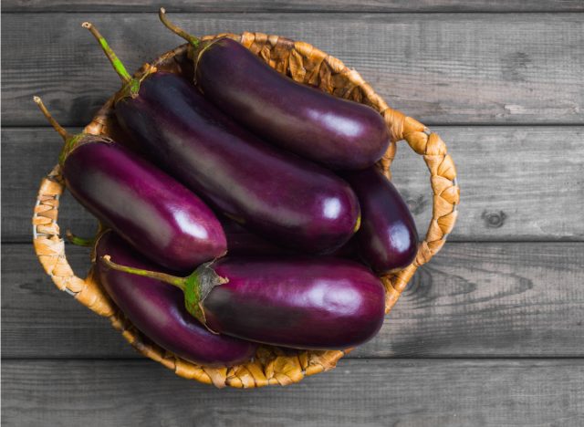 raw eggplant in basket