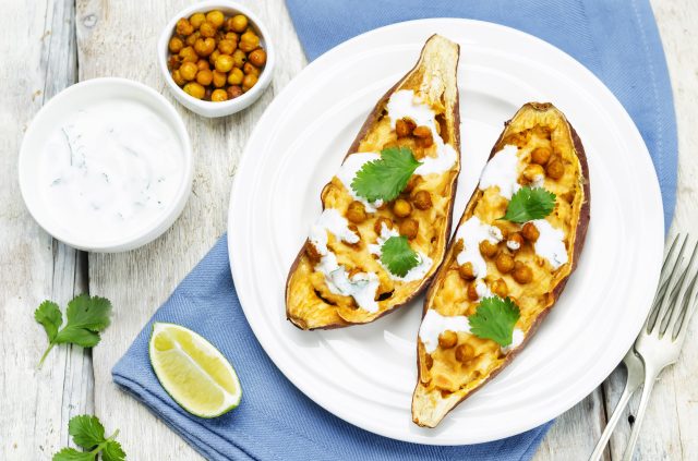 Roasted chickpeas stuffed sweet potato with Greek yogurt cilantro lime dressing