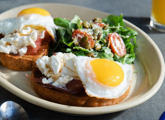 snooze, an am eatery burrata and prosciutto toast with eggs