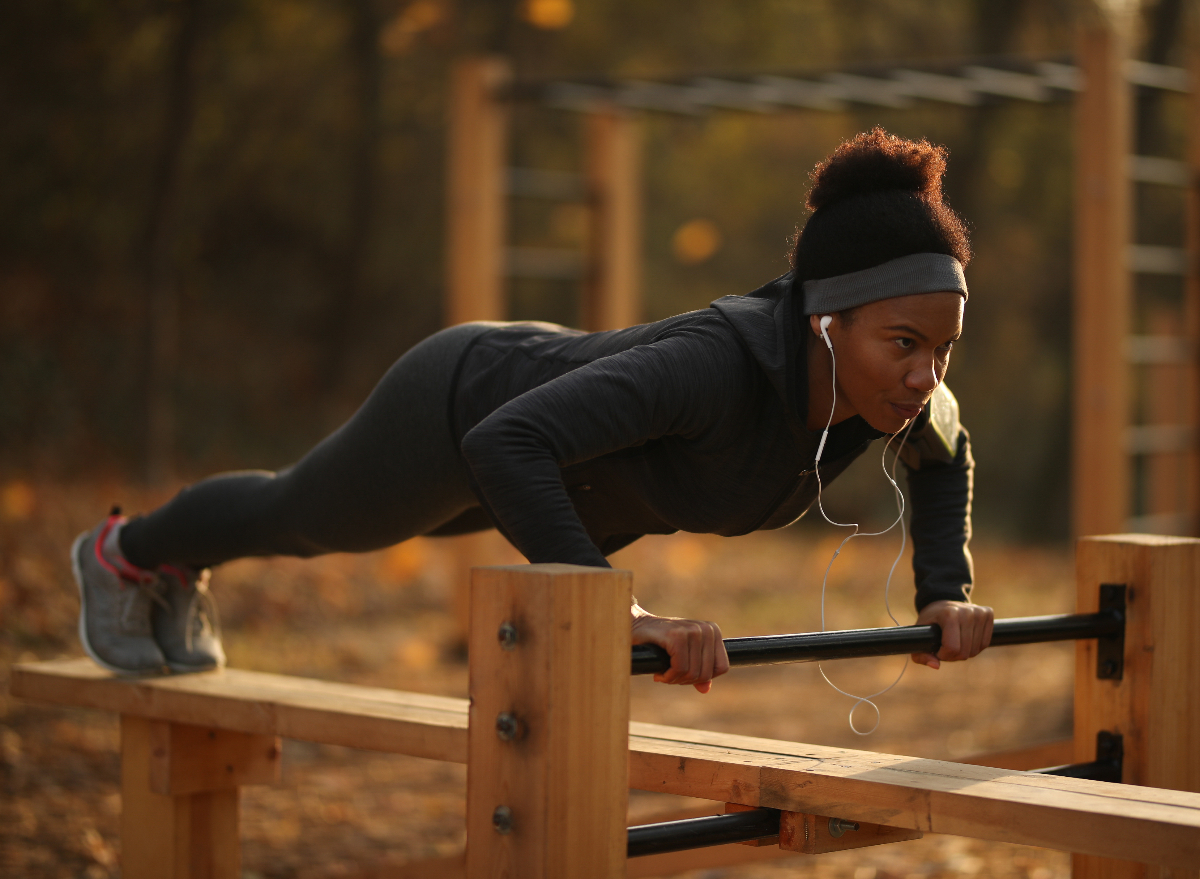 woman strength training tips bright day in park