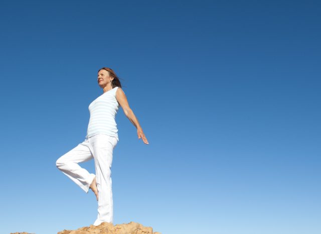 woman balancing on one leg