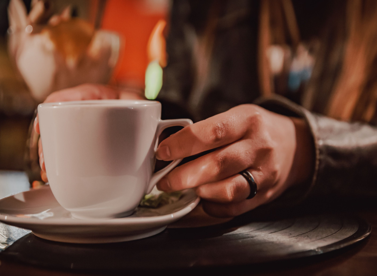 woman holding cup of tea