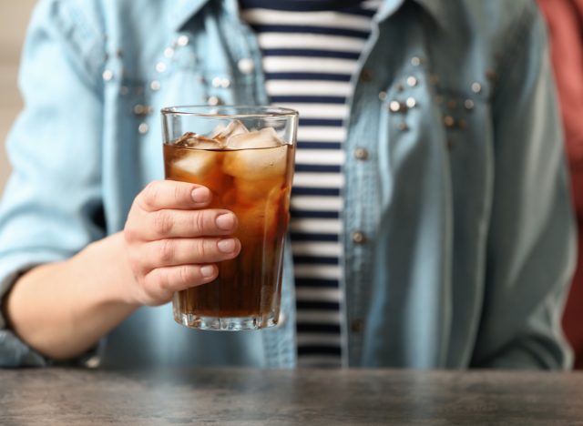 woman holding soda