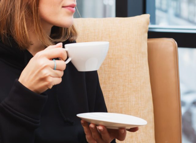 woman holding tea cup