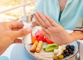 woman refusing salt shaker