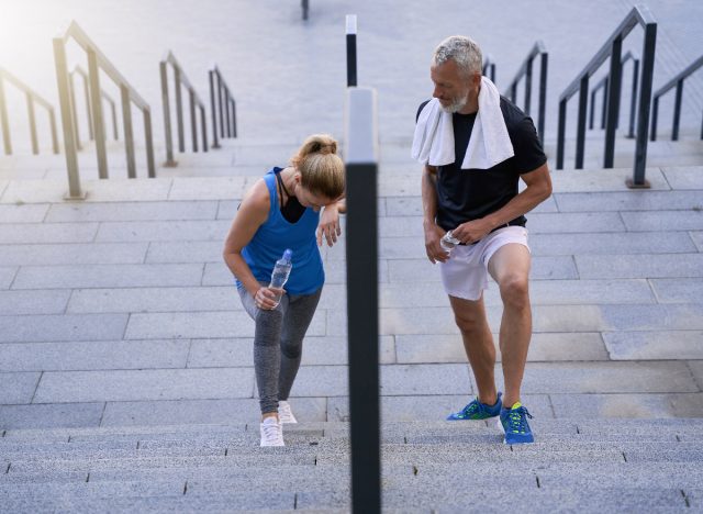 mature woman signs of poor fitness walking up steps