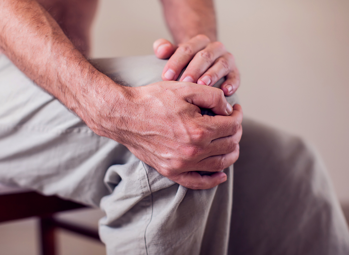 Man holding his knee, arthritis in knee