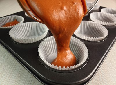 Pouring batter into cupcake pan