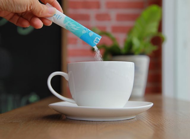 Pouring sugar into cup