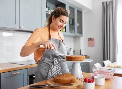 Woman decorating a cake