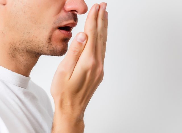 man with bad breath, side effects of not brushing teeth at night