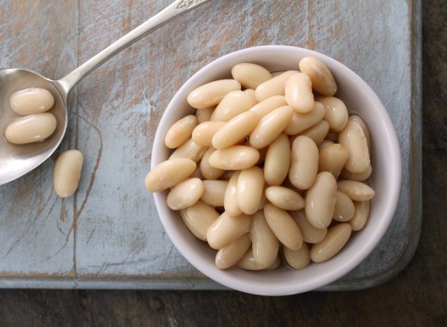 cannellini beans in dish with spoon