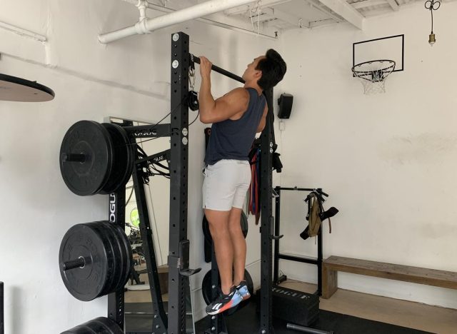 trainer performing chin-up