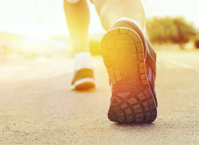 close-up feet walking exercise outdoors