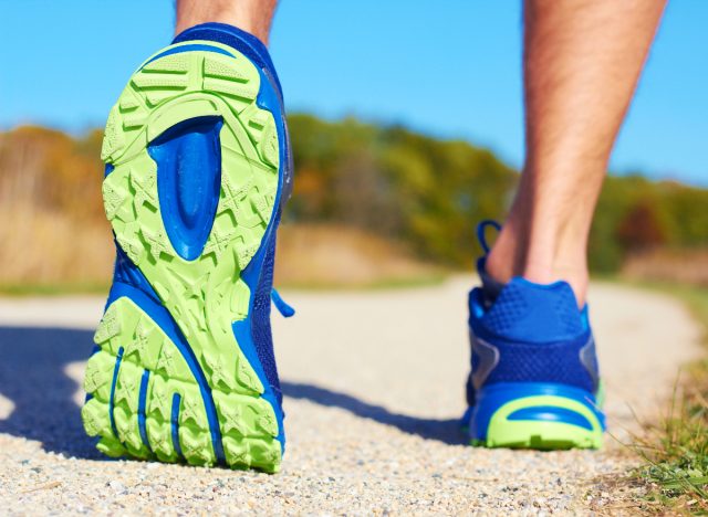 close-up sneakers walking, demonstrating fitness mistakes at 40