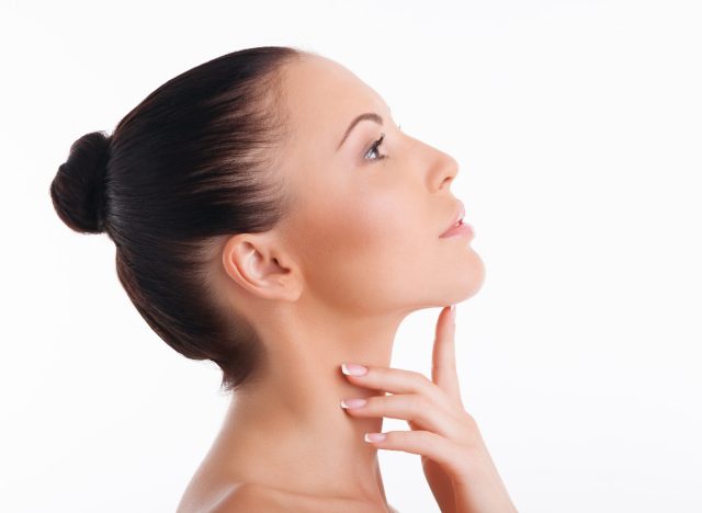 woman doing face yoga exercises