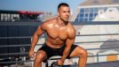 fit man doing an outdoor kettlebell workout to lose love handles in a week