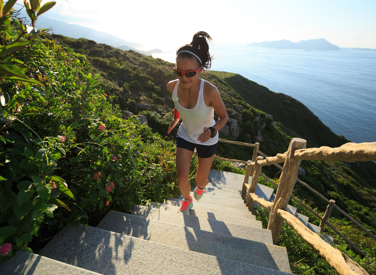 fit woman performing outdoor stair workout for quicker weight loss