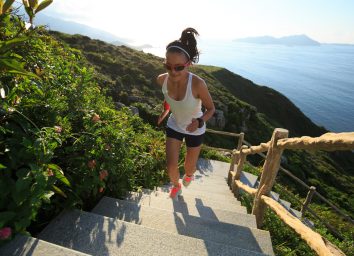 fit woman performing outdoor stair workout for quicker weight loss