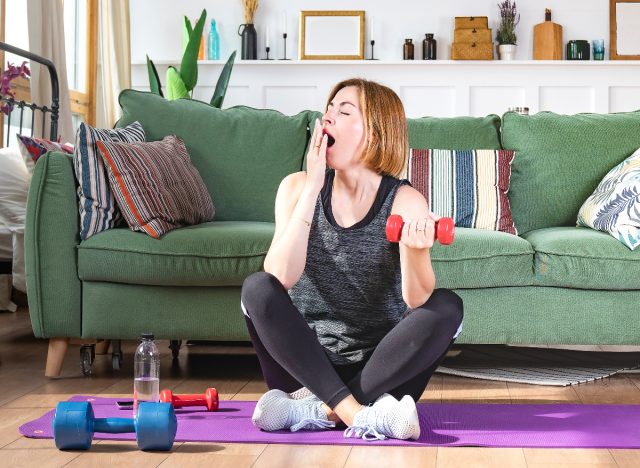 fit woman yawning before exercising at home, what happens to your body when you work out seven days a week