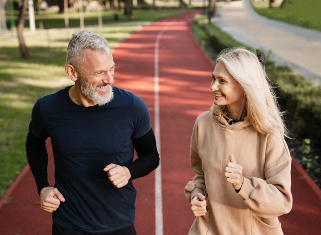 Happy mature couple doing exercise to live longer