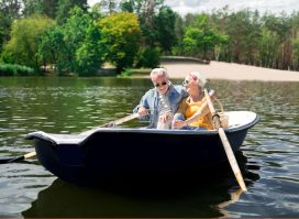 happy elderly couple boating, long marriage live longer