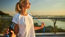 happy mature woman holding jump rope demonstrating how to lead an incredibly healthy lifestyle