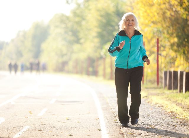 Happy old woman walks and exercises and maintains her health to be a hundred years old